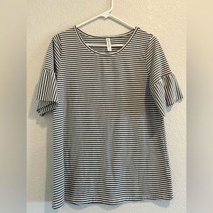 Woman’s striped tee shirt.